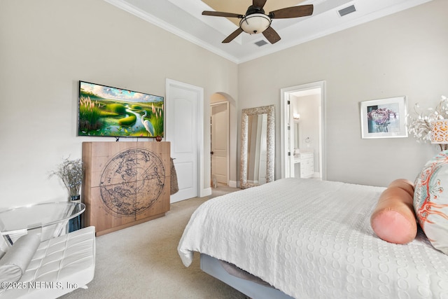 110 Heron Dr, Palm Coast, FL 32137 - carpeted bedroom featuring ornamental molding, arched walkways, ensuite bathroom, and a ceiling fan