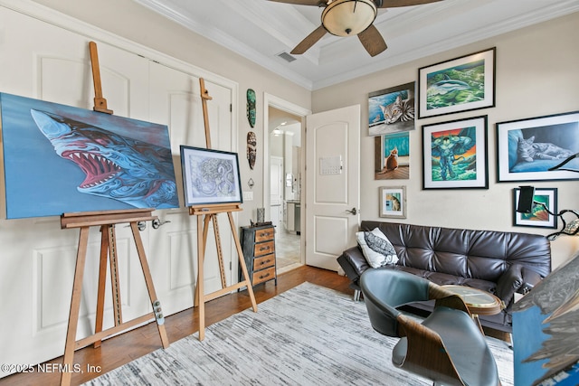 110 Heron Dr, Palm Coast, FL 32137 - living room featuring ceiling fan, crown molding, wood finished floors, and a tray ceiling