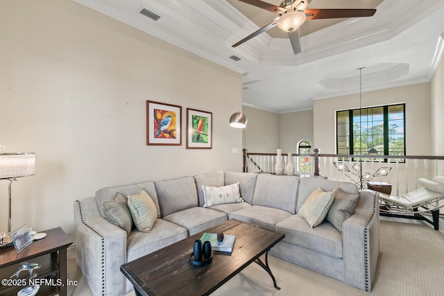 110 Heron Dr, Palm Coast, FL 32137 - carpeted living area featuring ornamental molding, a ceiling fan, and a raised ceiling