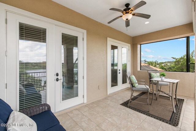 110 Heron Dr, Palm Coast, FL 32137 - sunroom / solarium with french doors, tile patterned floors, and recessed lighting