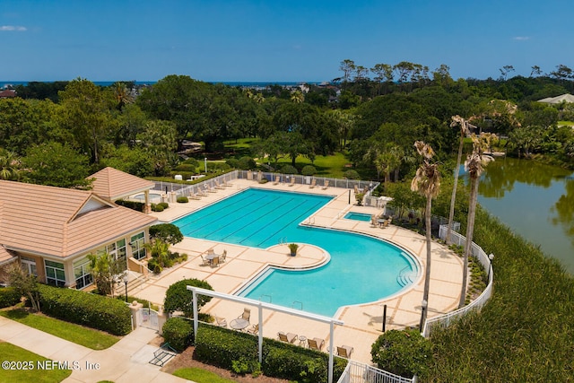 110 Heron Dr, Palm Coast, FL 32137 - community pool featuring a patio area, fence, and a water view