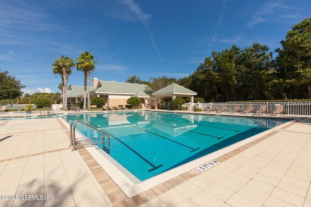 110 Heron Dr, Palm Coast, FL 32137 - community pool featuring fence and a patio