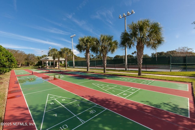 110 Heron Dr, Palm Coast, FL 32137 - view of home's community featuring a gazebo, shuffleboard, and fence