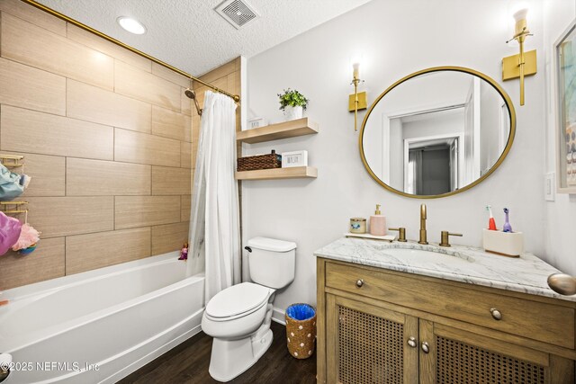 217 Willow Winds Pkwy, Saint Johns, FL 32259 - full bathroom with wood finished floors, vanity, shower / tub combo, toilet, and a textured ceiling