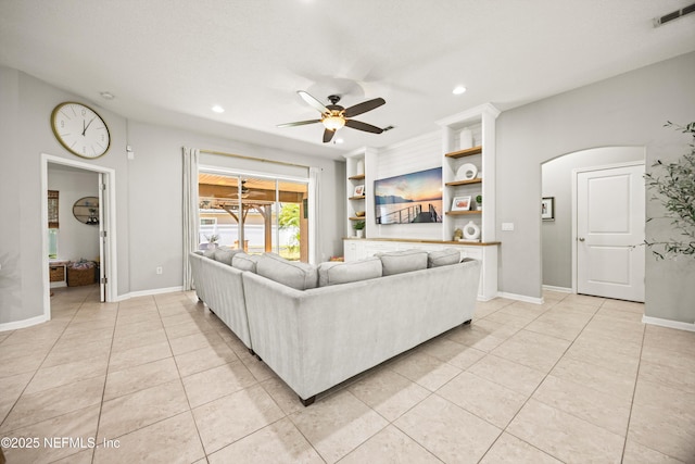 217 Willow Winds Pkwy, Saint Johns, FL 32259 - living area with a ceiling fan, arched walkways, recessed lighting, light tile patterned flooring, and baseboards