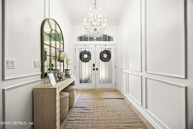 217 Willow Winds Pkwy, Saint Johns, FL 32259 - entryway featuring a chandelier, crown molding, and french doors
