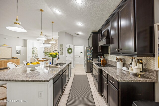 217 Willow Winds Pkwy, Saint Johns, FL 32259 - kitchen with a sink, backsplash, custom range hood, a textured ceiling, and black electric stovetop