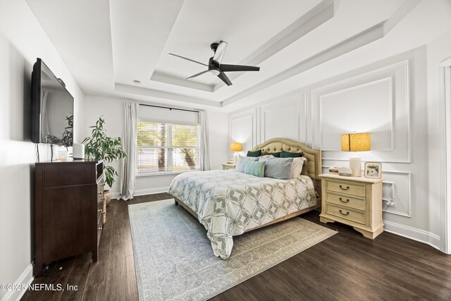 217 Willow Winds Pkwy, Saint Johns, FL 32259 - bedroom with a raised ceiling, dark wood-style floors, and baseboards