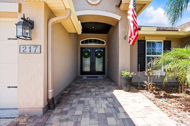 217 Willow Winds Pkwy, Saint Johns, FL 32259 - view of exterior entry featuring french doors and stucco siding