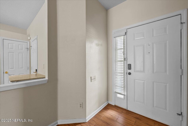 7990 Baymeadows Rd Unit 1305, Jacksonville, FL 32256 - foyer with baseboards and wood finished floors