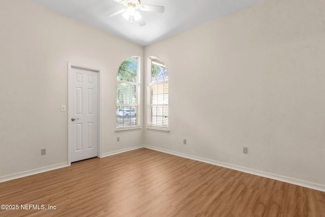 96131 River Marsh Bnd, Fernandina Beach, FL 32034 - spare room featuring a ceiling fan, light wood finished floors, and baseboards
