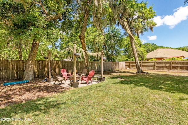 96131 River Marsh Bnd, Fernandina Beach, FL 32034 - view of yard featuring an outdoor fire pit