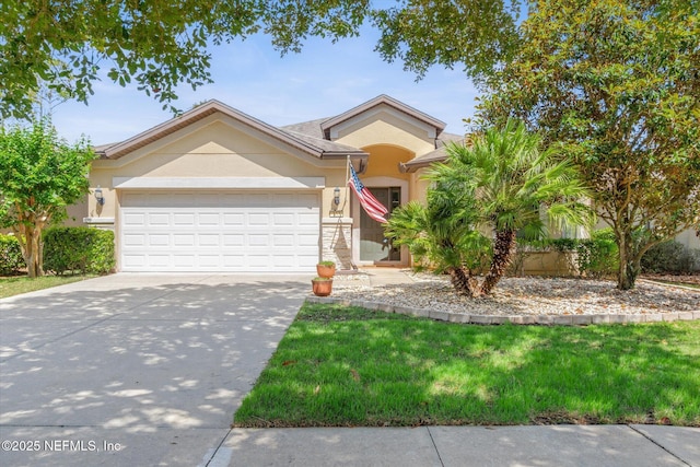 153 Hammocks Landing Dr, Ponte Vedra, FL 32081 - view of front facade featuring stucco siding, an attached garage, concrete driveway, and a front lawn