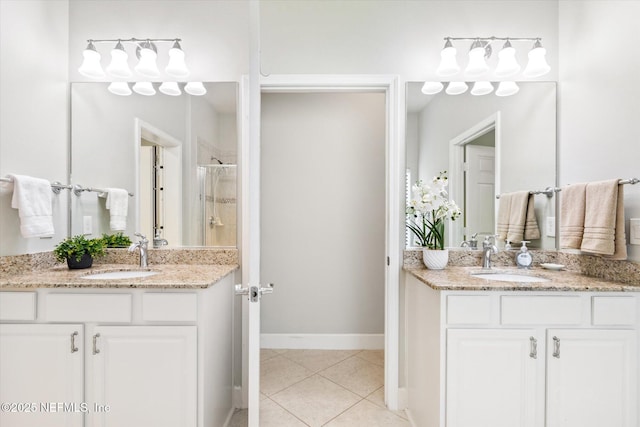 153 Hammocks Landing Dr, Ponte Vedra, FL 32081 - full bath featuring a stall shower, tile patterned flooring, two vanities, and baseboards