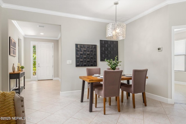 153 Hammocks Landing Dr, Ponte Vedra, FL 32081 - dining space with crown molding, baseboards, light tile patterned flooring, and a chandelier