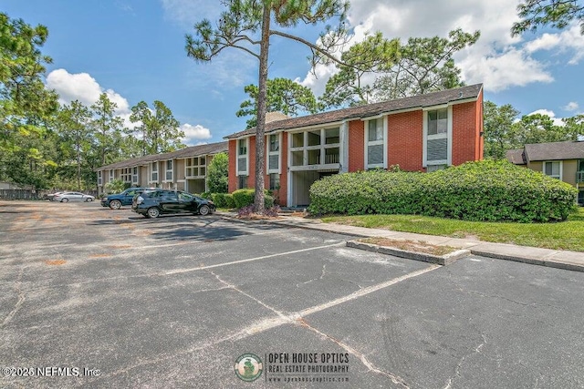 8849 Old Kings Rd S Unit 189, Jacksonville, FL 32257 - view of building exterior featuring uncovered parking