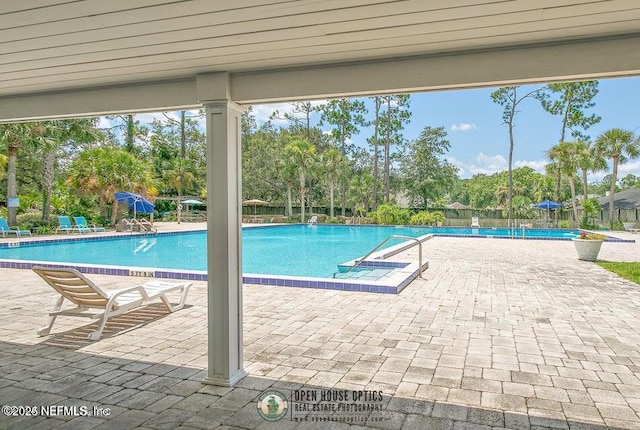 8849 Old Kings Rd S Unit 189, Jacksonville, FL 32257 - community pool with a patio and view of scattered trees
