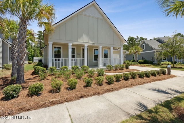 250 Ponder Cir, Yulee, FL 32097 - view of front facade featuring board and batten siding and a porch