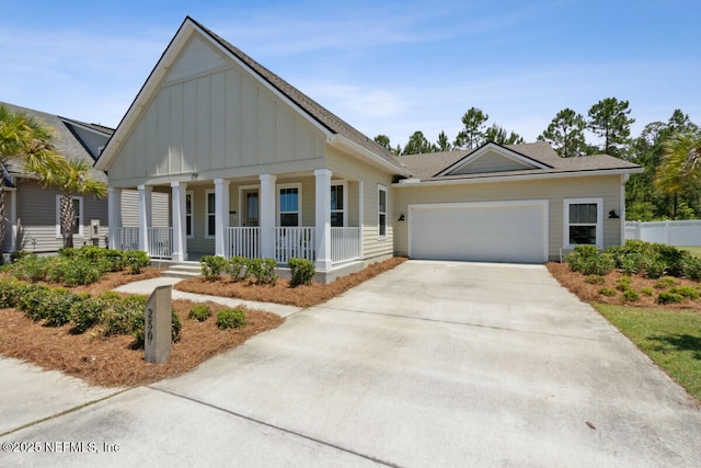 250 Ponder Cir, Yulee, FL 32097 - view of front of property with board and batten siding, covered porch, driveway, a garage, and a shingled roof