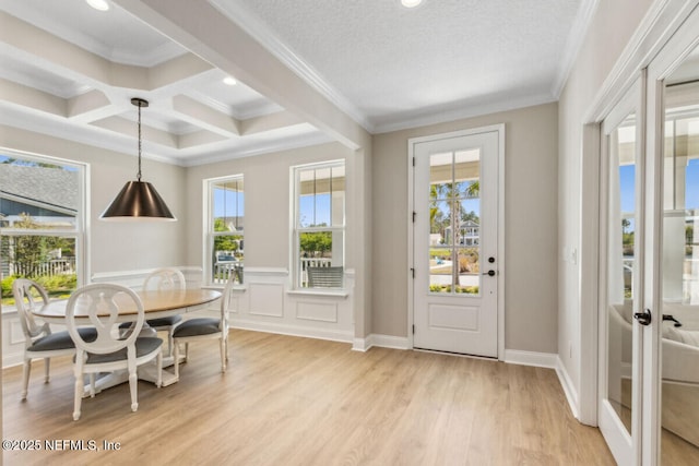 250 Ponder Cir, Yulee, FL 32097 - dining room with light wood-style floors, ornamental molding, beamed ceiling, coffered ceiling, and wainscoting
