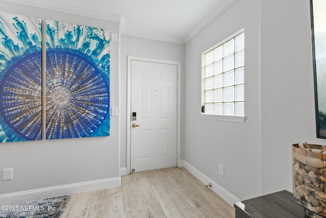1701 The Greens Way Unit 1411, Jacksonville Beach, FL 32250 - entrance foyer featuring crown molding, baseboards, and light wood-style floors