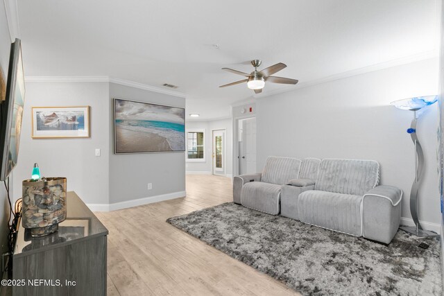 1701 The Greens Way Unit 1411, Jacksonville Beach, FL 32250 - living area featuring ornamental molding, a ceiling fan, wood finished floors, and baseboards