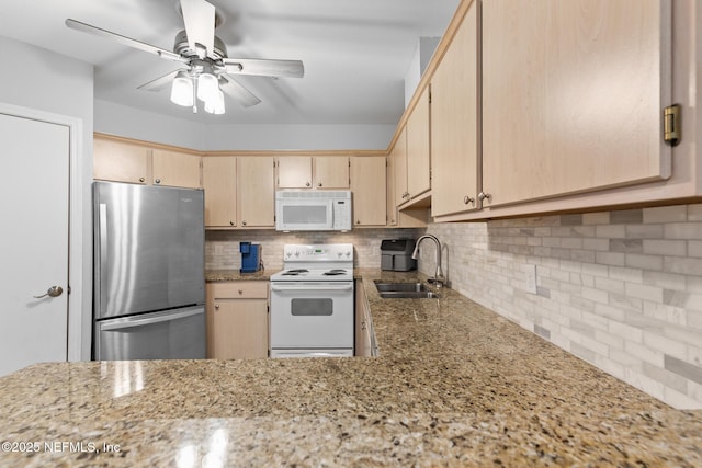 1701 The Greens Way Unit 1411, Jacksonville Beach, FL 32250 - kitchen with white appliances, a sink, tasteful backsplash, ceiling fan, and light brown cabinets