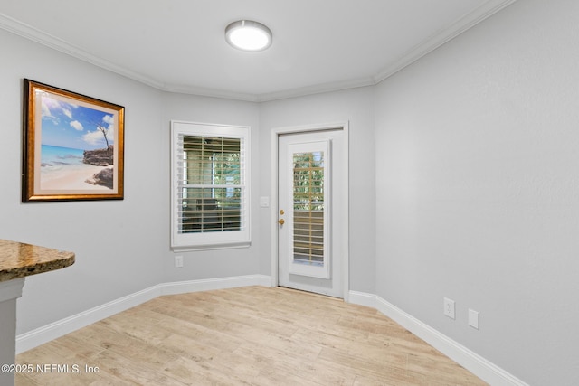 1701 The Greens Way Unit 1411, Jacksonville Beach, FL 32250 - entryway with light wood-type flooring, ornamental molding, and baseboards