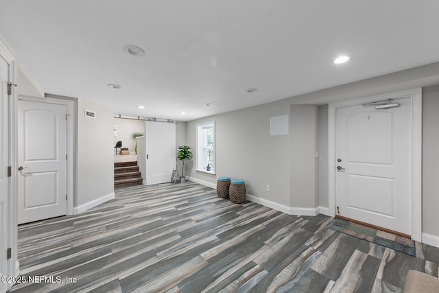 1823 Mauva Juan Ave, Jacksonville, FL 32225 - basement featuring baseboards, wood finished floors, recessed lighting, and stairway