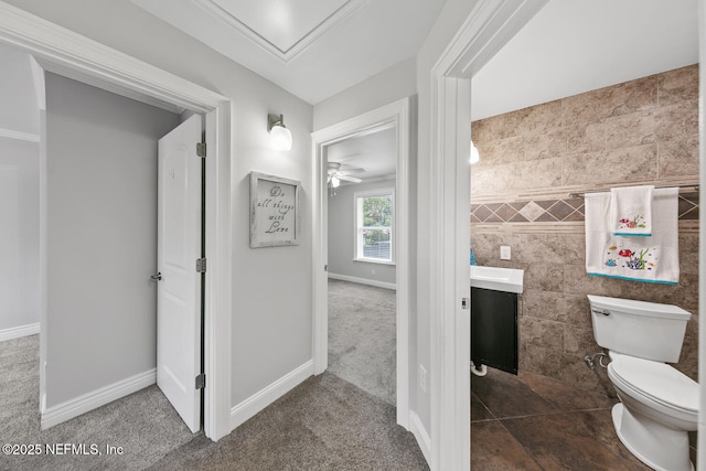 1823 Mauva Juan Ave, Jacksonville, FL 32225 - bathroom featuring toilet, a ceiling fan, vanity, and baseboards