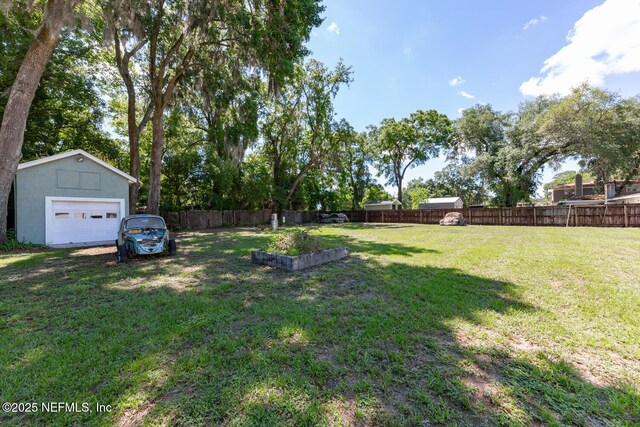 1823 Mauva Juan Ave, Jacksonville, FL 32225 - view of yard with a garage and an outdoor structure
