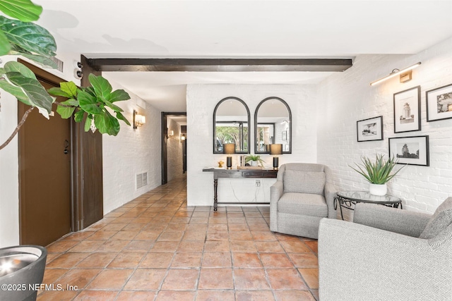 1846 Margaret St Unit 7C, Jacksonville, FL 32204 - hallway with beam ceiling and brick wall