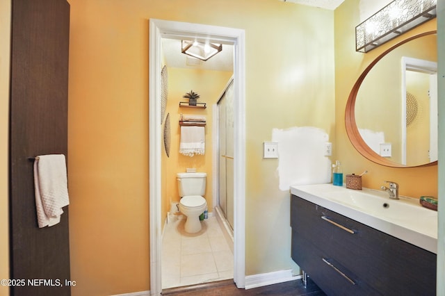 705 Marsh Cove Pl, Ponte Vedra Beach, FL 32082 - full bathroom featuring toilet, a stall shower, vanity, tile patterned floors, and baseboards