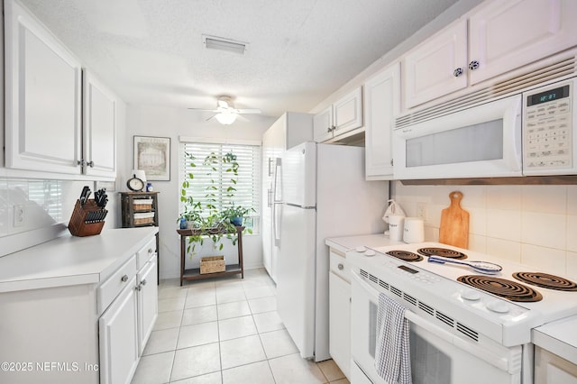 705 Marsh Cove Pl, Ponte Vedra Beach, FL 32082 - kitchen featuring white appliances, light countertops, decorative backsplash, white cabinetry, and a textured ceiling