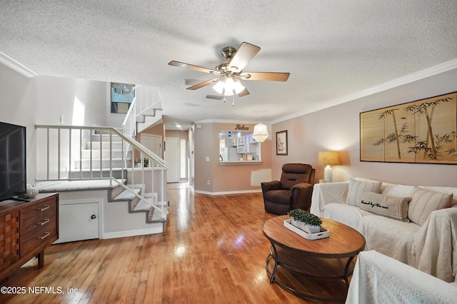 705 Marsh Cove Pl, Ponte Vedra Beach, FL 32082 - living area with a textured ceiling, hardwood / wood-style floors, stairway, crown molding, and a ceiling fan
