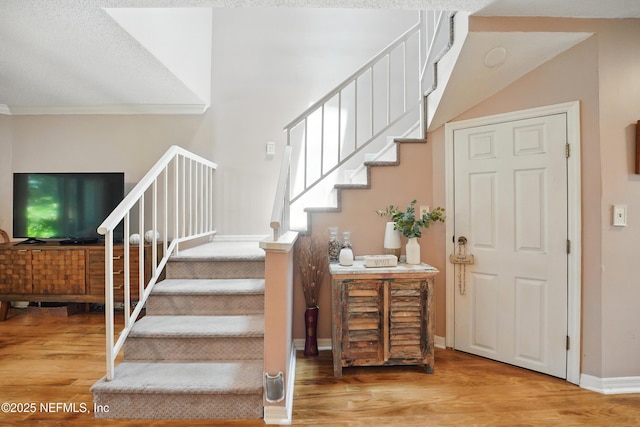 705 Marsh Cove Pl, Ponte Vedra Beach, FL 32082 - stairway featuring wood finished floors, baseboards, and crown molding