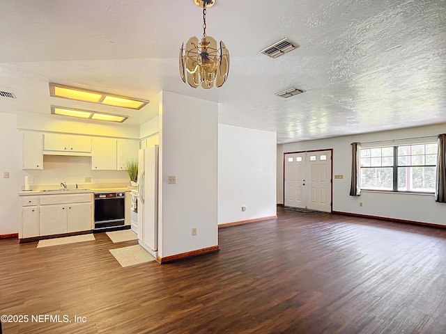 23063 SW Edgewater Blvd, Dunnellon, FL 34431 - unfurnished living room featuring a sink, dark wood finished floors, baseboards, and a chandelier