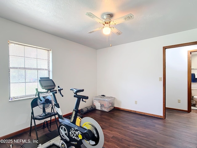 23063 SW Edgewater Blvd, Dunnellon, FL 34431 - exercise area featuring ceiling fan, wood finished floors, and baseboards