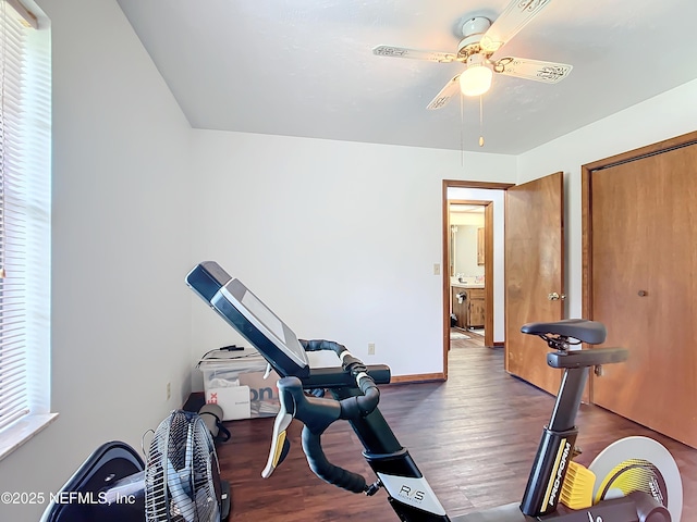 23063 SW Edgewater Blvd, Dunnellon, FL 34431 - exercise room featuring wood finished floors, ceiling fan, and baseboards