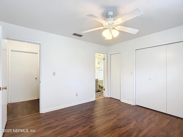 23063 SW Edgewater Blvd, Dunnellon, FL 34431 - unfurnished bedroom featuring wood finished floors, ensuite bath, baseboards, and a ceiling fan