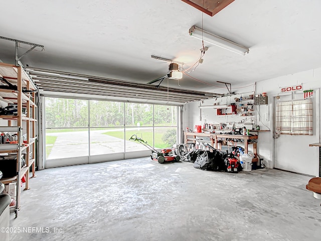 23063 SW Edgewater Blvd, Dunnellon, FL 34431 - garage with a garage door opener and a workshop area