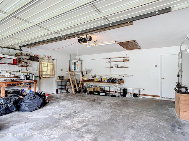 23063 SW Edgewater Blvd, Dunnellon, FL 34431 - garage with a workshop area, water heater, and a garage door opener