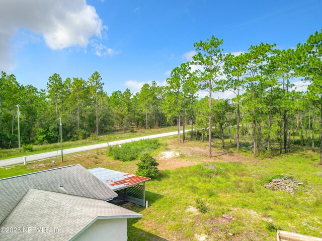 23063 SW Edgewater Blvd, Dunnellon, FL 34431 - view of yard featuring a wooded view