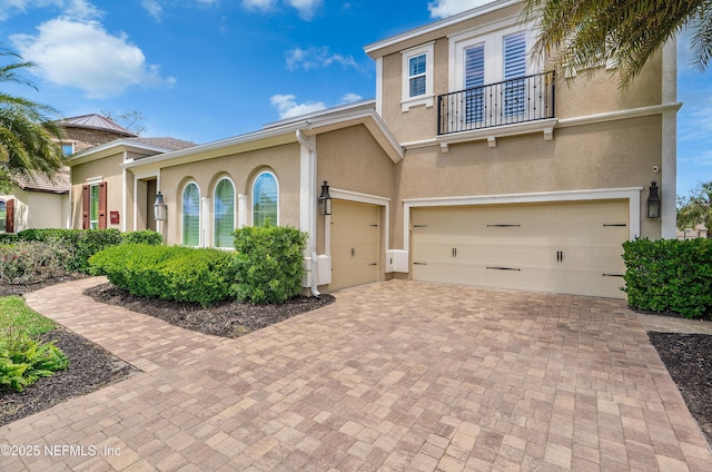 361 Amalurra Trl, Saint Johns, FL 32259 - view of front of home featuring a balcony, stucco siding, and an attached garage