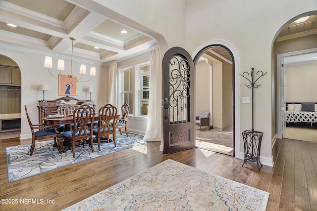 361 Amalurra Trl, Saint Johns, FL 32259 - dining room featuring hardwood / wood-style floors, arched walkways, beam ceiling, crown molding, and coffered ceiling
