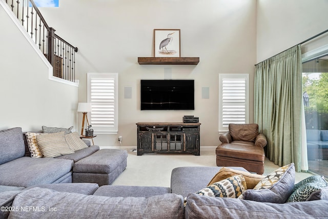 361 Amalurra Trl, Saint Johns, FL 32259 - living area featuring a towering ceiling, carpet floors, and baseboards