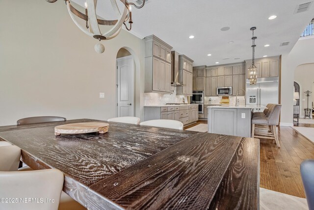 361 Amalurra Trl, Saint Johns, FL 32259 - dining area featuring arched walkways, recessed lighting, and light wood-type flooring