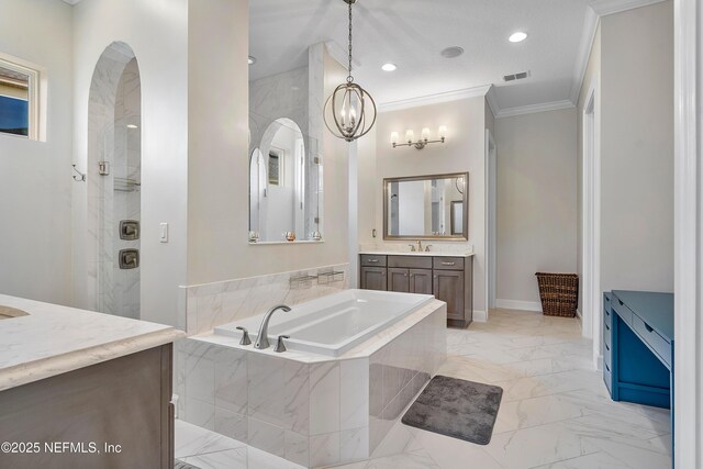 361 Amalurra Trl, Saint Johns, FL 32259 - bathroom featuring marble look tiles, a garden tub, vanity, ornamental molding, and a chandelier