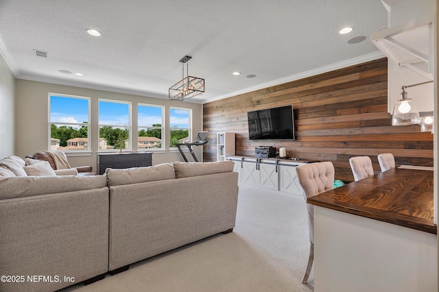 361 Amalurra Trl, Saint Johns, FL 32259 - carpeted living area featuring ornamental molding, wooden walls, a textured ceiling, and recessed lighting