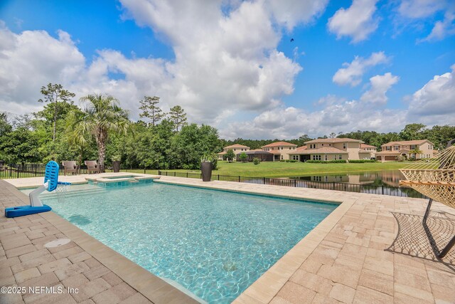 361 Amalurra Trl, Saint Johns, FL 32259 - view of pool with a patio, a pool with connected hot tub, fence, and a water view